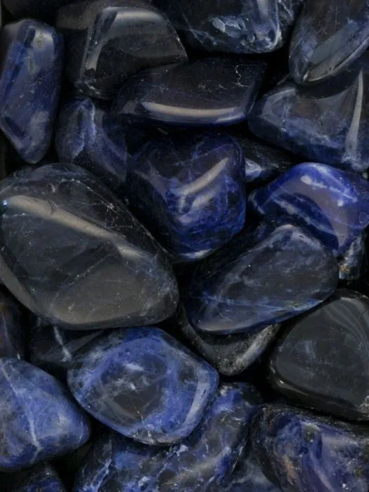 black lapis lazuli · natural pearls · gold-plated accents — close-up